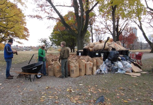 The Charles River Conservancy's Danielle Stehlik and volunteer Sam counting the bags.